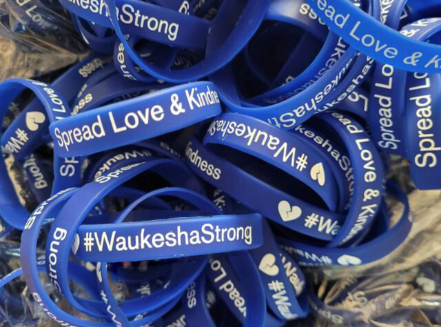 A pile of #WaukeshaStrong rubber bracelets